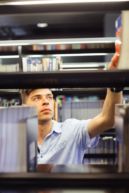 Young student taking book