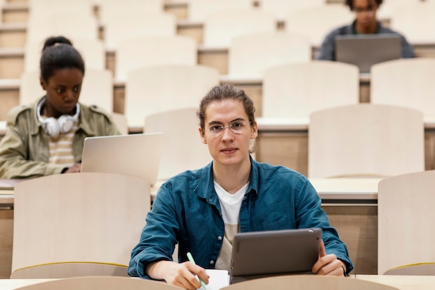 Young students attending a university class