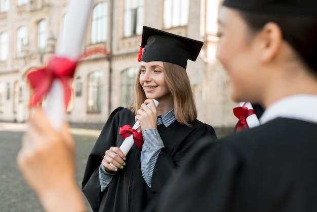 Free Photo young students celebrating their graduation