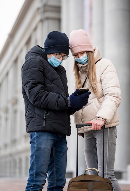 Free Photo young students with masks abroad