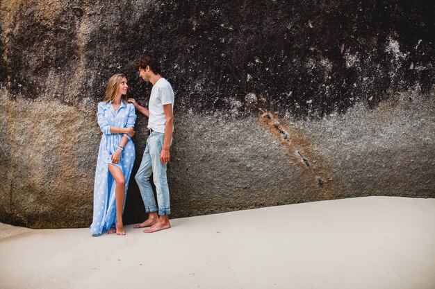 Young stylish hipster couple in love on tropical beach during vacation