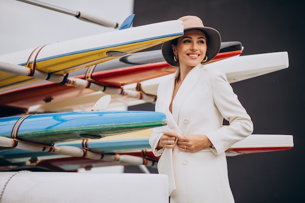 Free photo young stylish woman in white jacket travelling