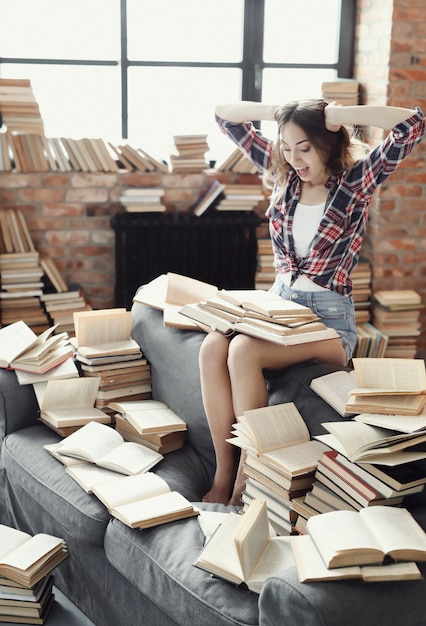 Free photo young teenager girl reading a book at home