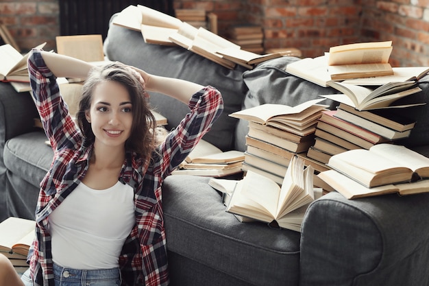 Free Photo young teenager girl reading a book at home