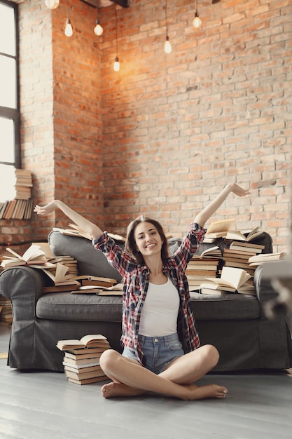 Free photo young teenager girl reading a book at home