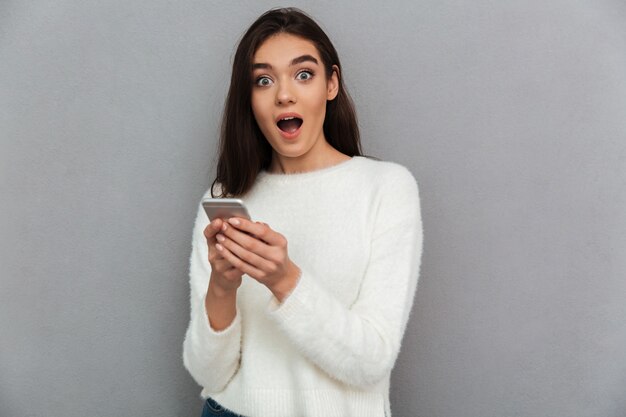 Young teenager woman with smartphone