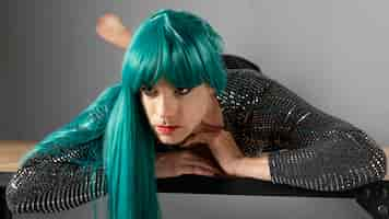 Free photo young transgender person wearing green wig front view