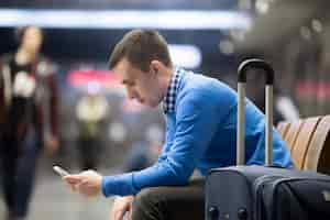 Free photo young traveler waiting at airport