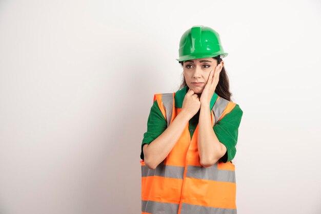 Young woman architect in uniform and helmet. High quality photo