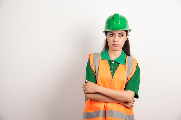 Young woman architect in uniform and helmet. High quality photo