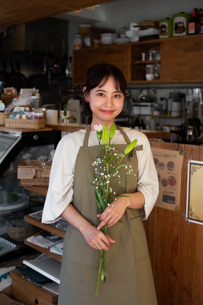 Young woman arranging her cake shop