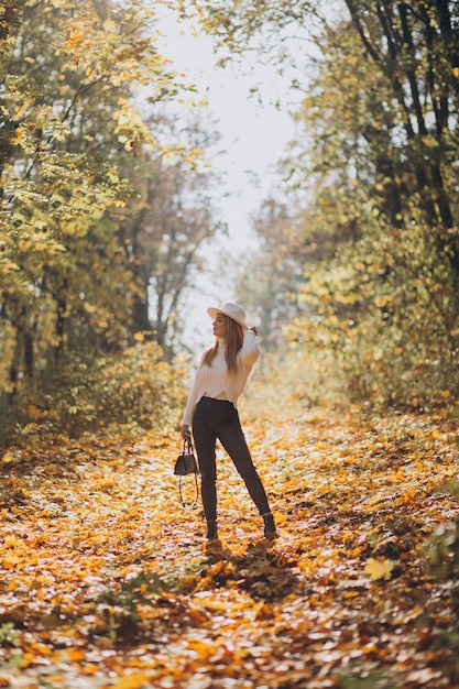 Young woman in an autumn park