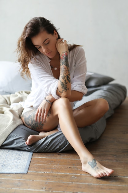 Young woman in bed at morning