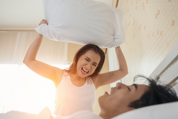 Young woman bored with her boyfriend snoring