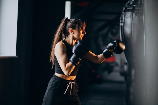 Free Photo young woman boxer training at the gym