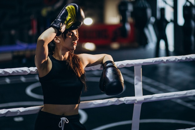 Free Photo young woman boxer training at the gym