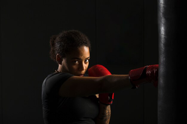 Young woman boxing in the gym