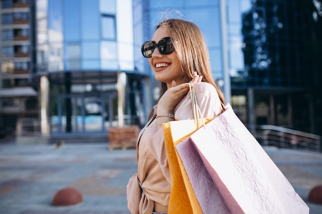 Young woman by the shopping center