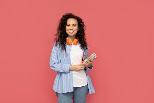 Young woman in casual wearing on pink background