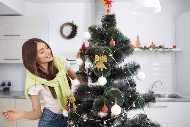 Young woman celebrating christmas at home