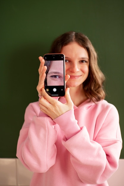 Young woman connected to her smartphone