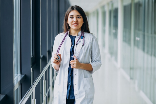 Young woman doctor with stethoscope at hospital