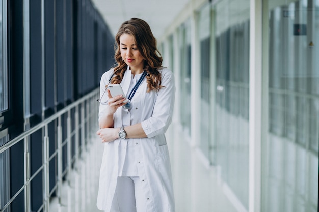 Young woman doctor with stethoscope at hospital