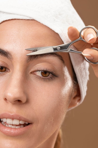 Young woman doing a beauty treatment for herself