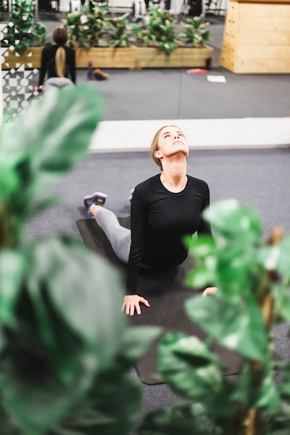 Young woman doing exercise in gym