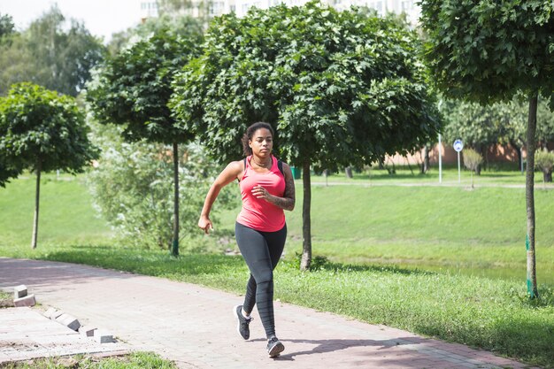 Young woman doing exercise in the park