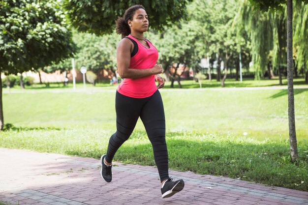 Young woman doing exercise in the park