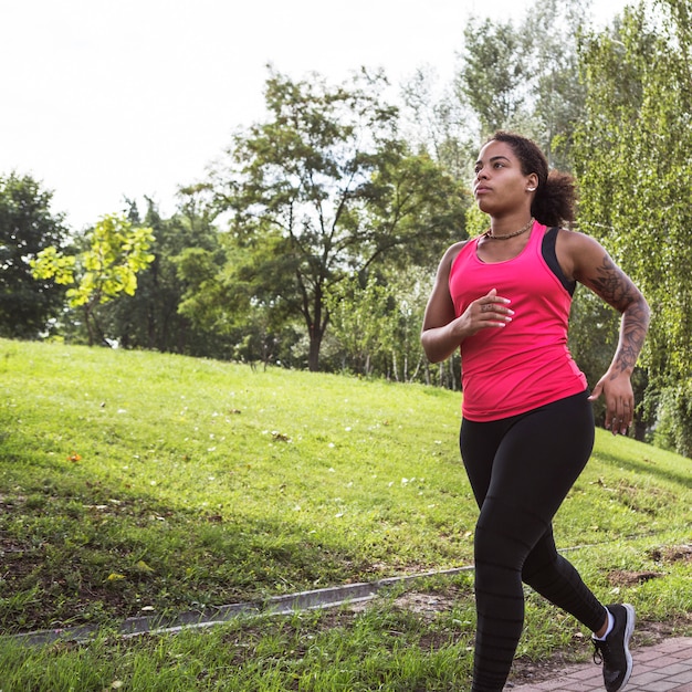 Young woman doing exercise in the park