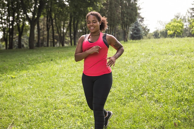 Young woman doing exercise in the park