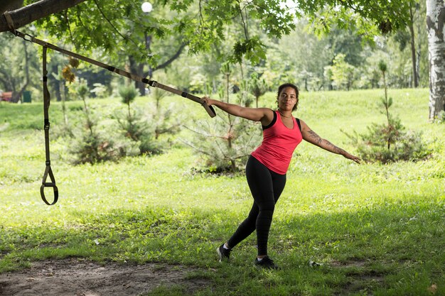 Young woman doing exercise in the park