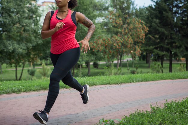 Young woman doing exercise in the park