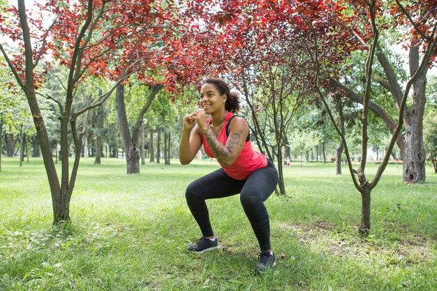 Young woman doing exercise in the park