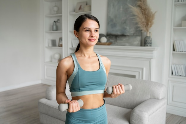 Young woman doing her workout at home