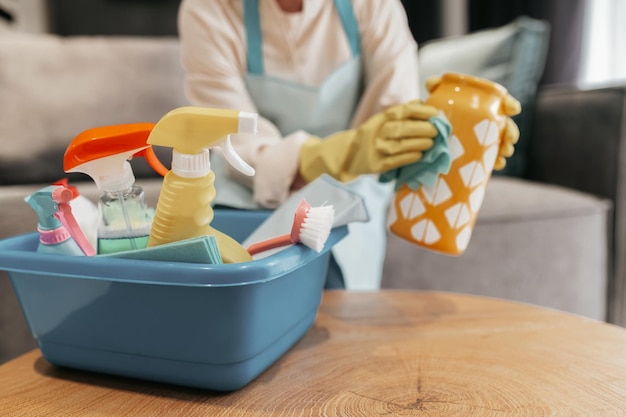 Free photo young woman doing housework and looking busy