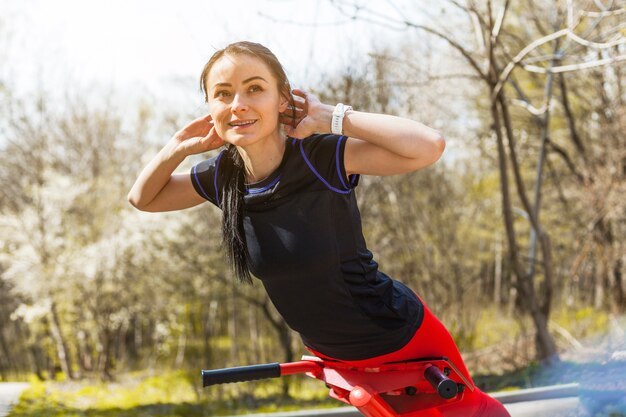 Young woman doing outdoors excercises