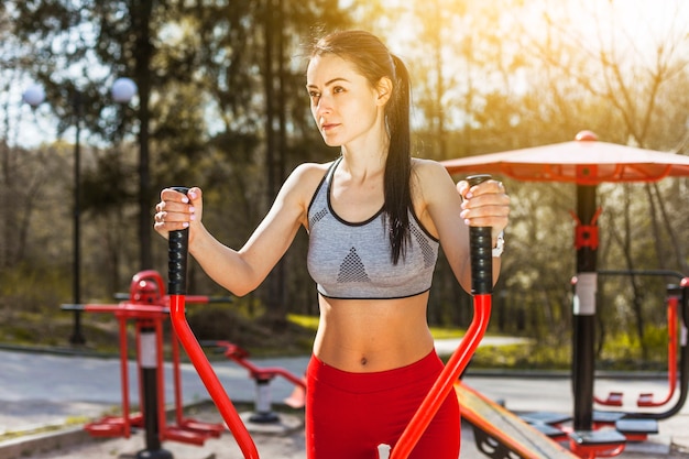 Young woman doing outdoors excercises