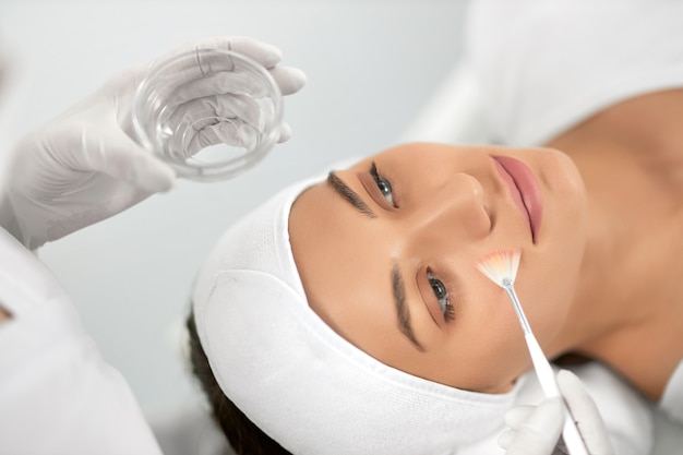 Free Photo young woman doing procedure for face in beautician