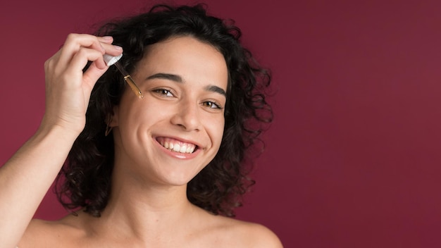 Free photo young woman doing skin care