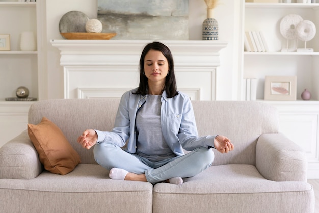 Young woman doing yoga at home