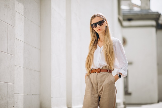 Young woman dressed in summer outfit out in the city