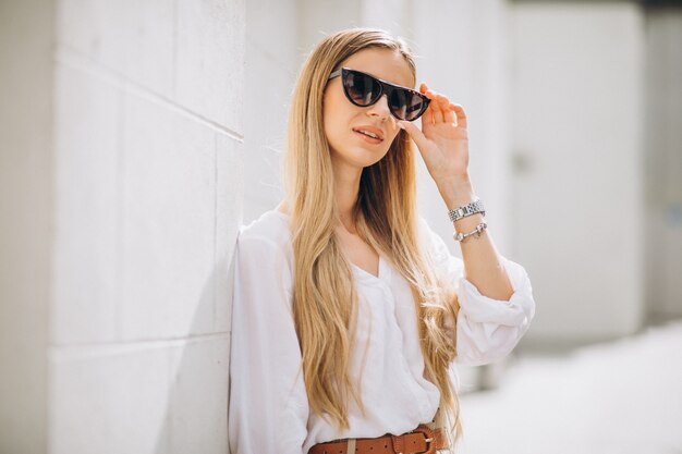 Young woman dressed in summer outfit out in the city