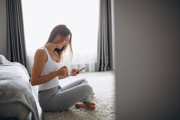 Young woman drinking coffee at home