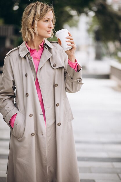 Young woman drinking coffee out in the city