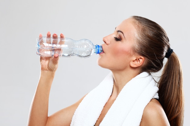 Young woman drinking water