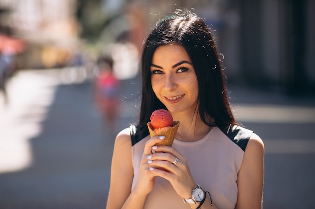 Young woman eating ice cream