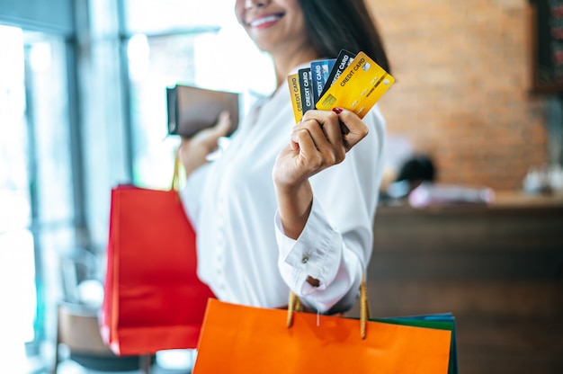 Young woman enjoy shopping with credit cards.